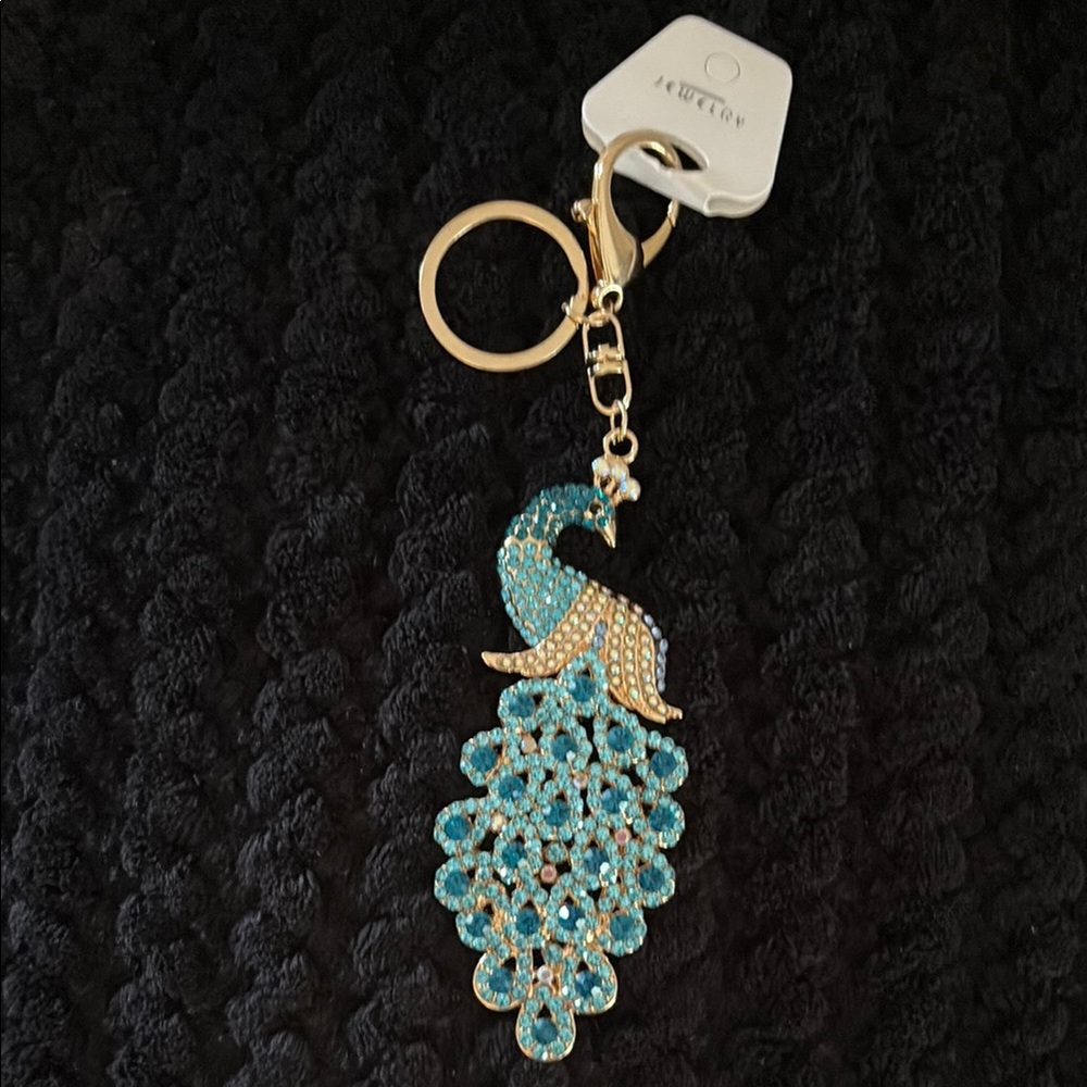 Elegant Peacock Keychain with Blue and Gold Accents
